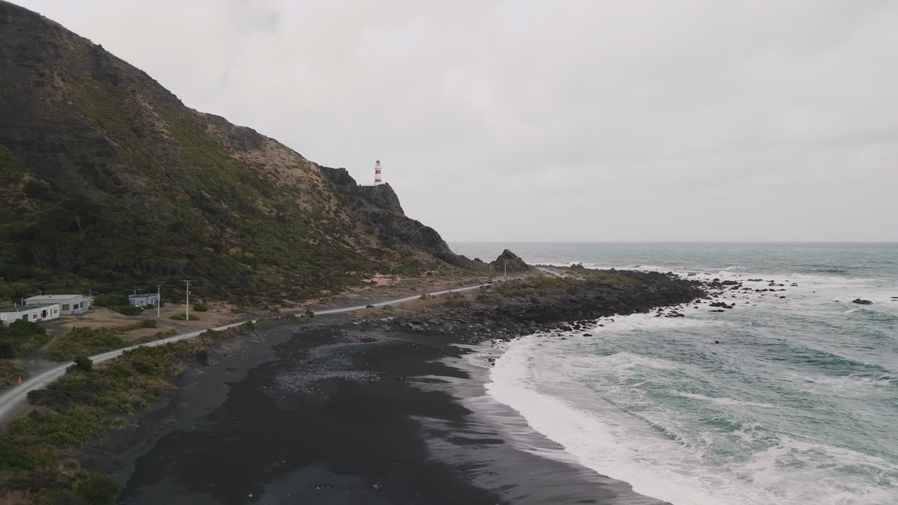 Coastal View with Lighthouse and Black Sand Beach