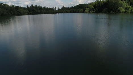 aerial drone view of a lake in france. low altitude flight