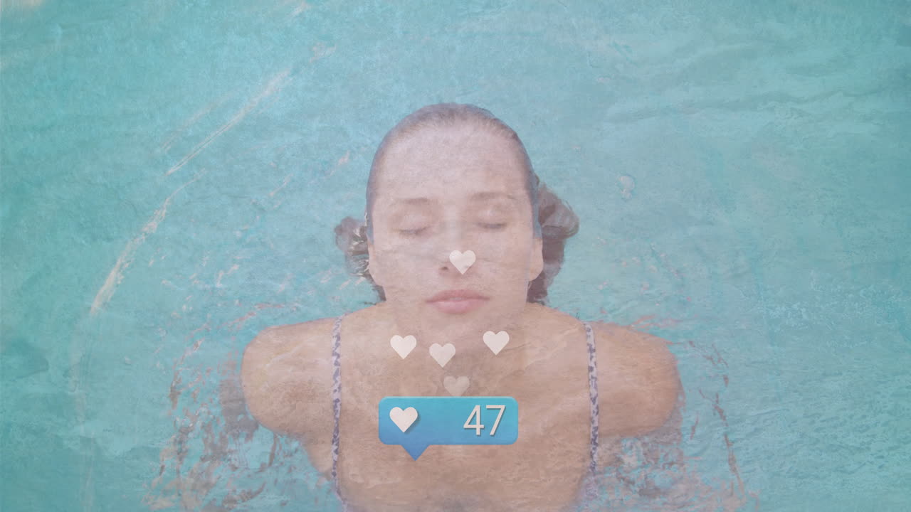 Swimming underwater, woman surrounded by social media likes animation overlay
