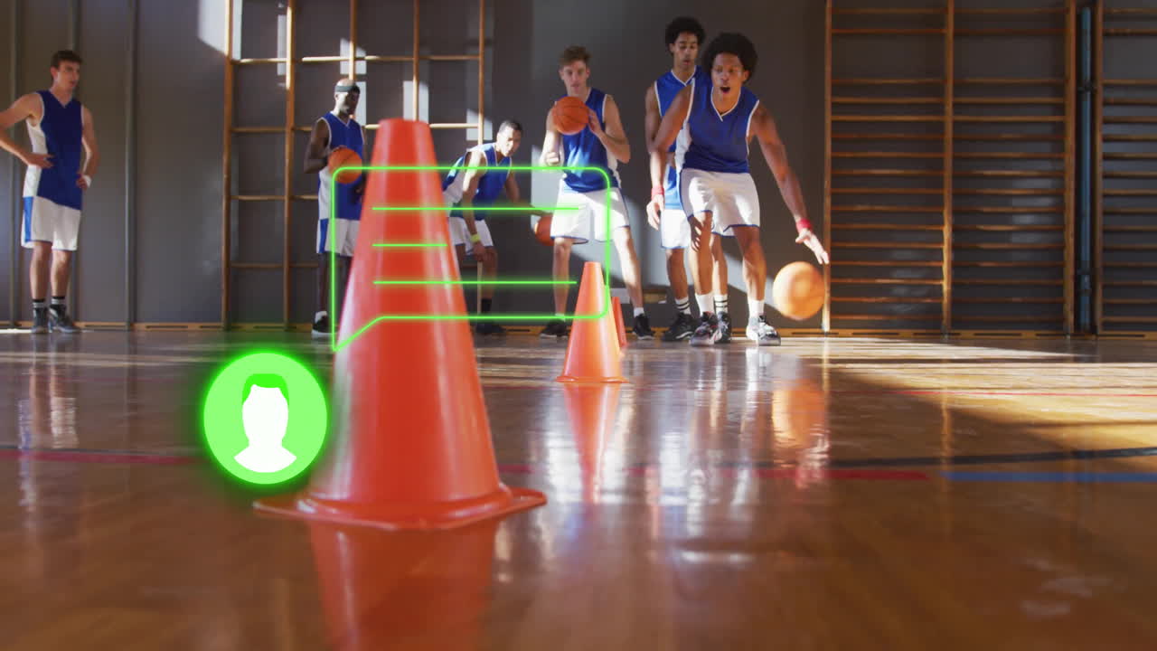 Basketball players practicing dribbling around cones with digital overlay animation