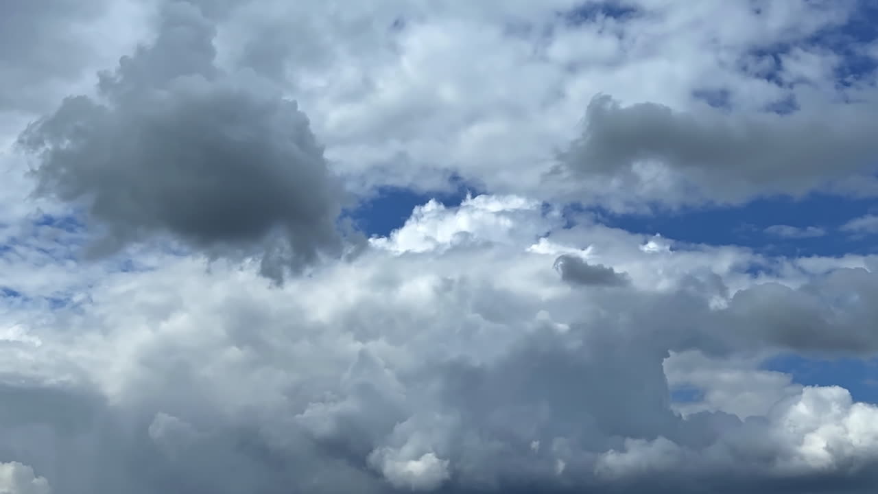 Flight among the fluffy cotton clouds in the atmosphere. Inside out of the huge cumulus cloudscape in the sky