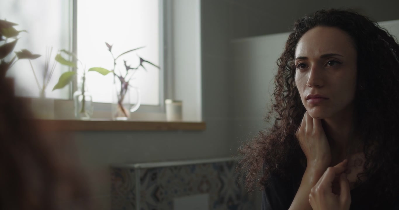 A woman with wet face and hands