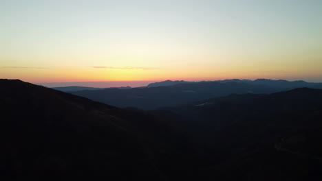 A-drone-pans-the-horizon-of-mountains-near-Estepona-at-sunset