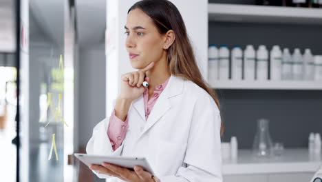 scientist in laboratory, woman is thinking