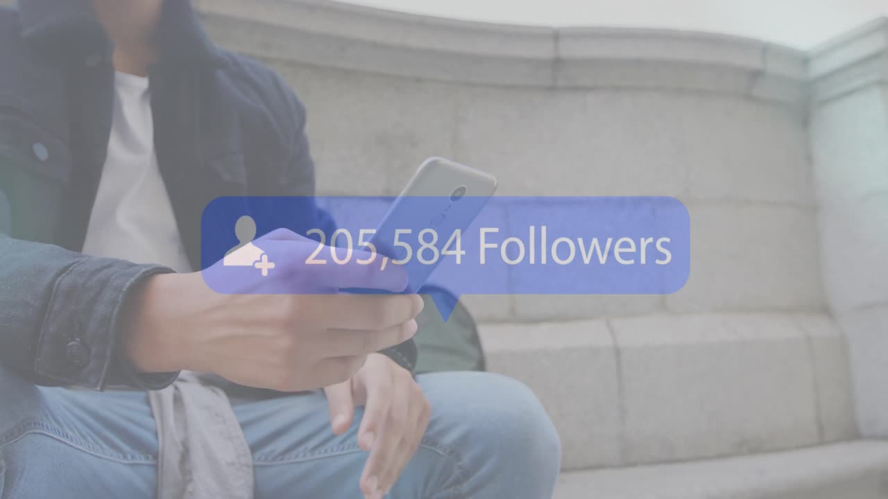 Animation of social media icons over men using smartphone