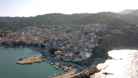 Beautiful-aerial-panoramic-view-over-the-famous-Skopelos-town-In-Sporades,-Greece-during-sunset