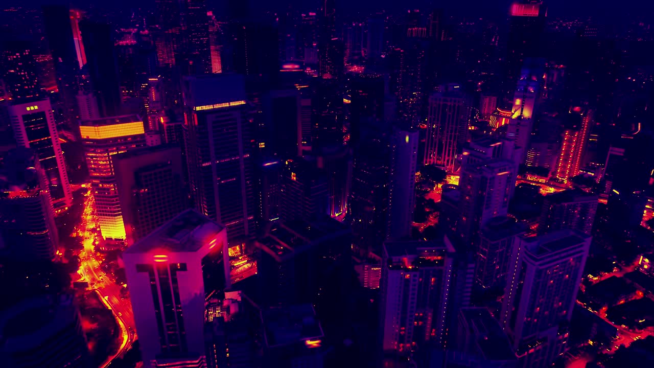 Aerial view of skyscrapers at the Kuala Lumpur city in the 80s style video, neon colors. Wide shot 4k shot