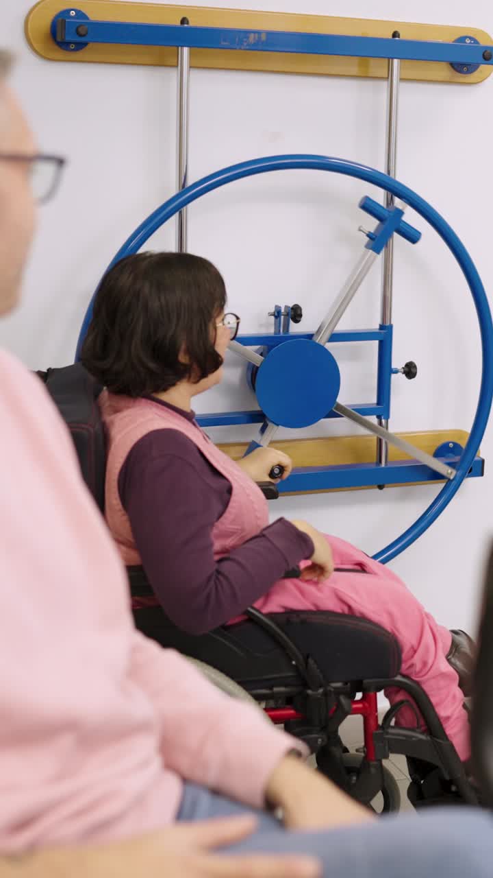 Woman exercising on rehabilitation equipment