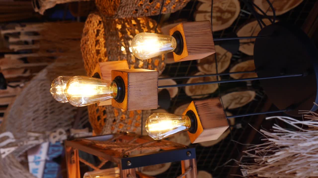 A modern and rustic decorative lighting fixture with wooden cube lamp holders