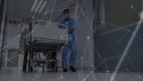 medical staff pushing hospital bed, network of connections animation over scene