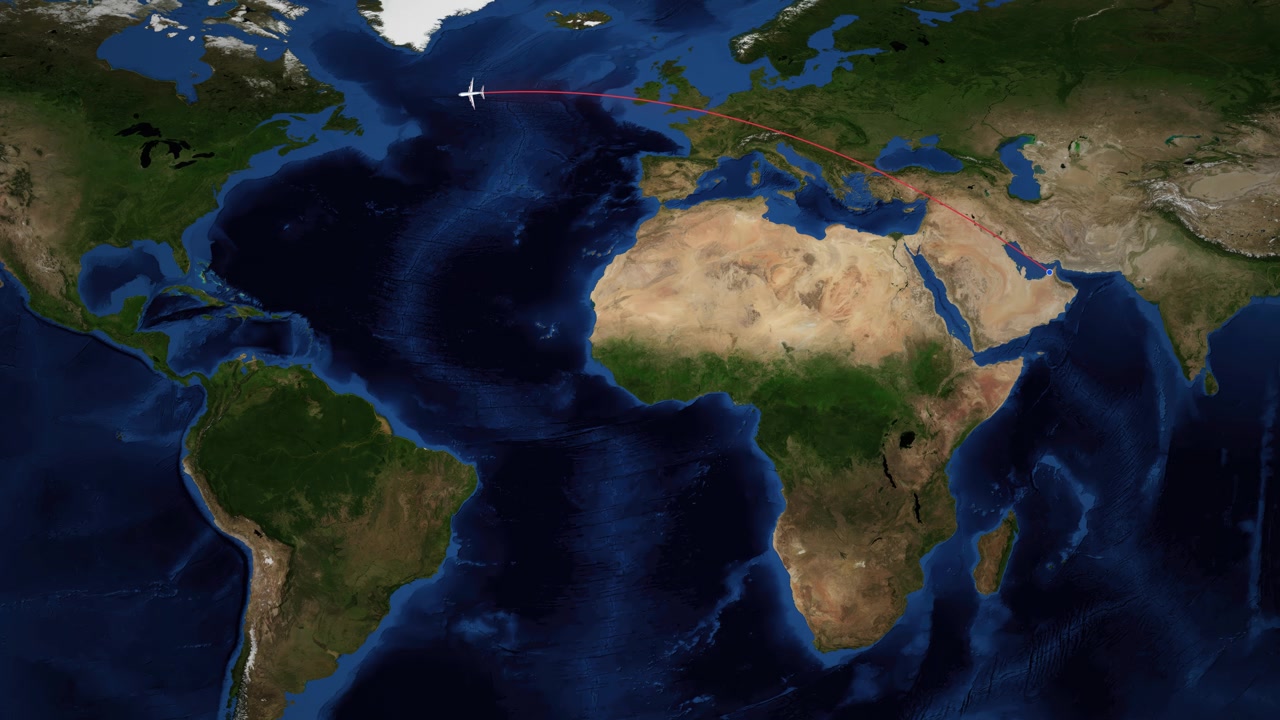 Una linea rossa traccia un aereo che vola da Dubai a Montreal su una mappa del mondo.
