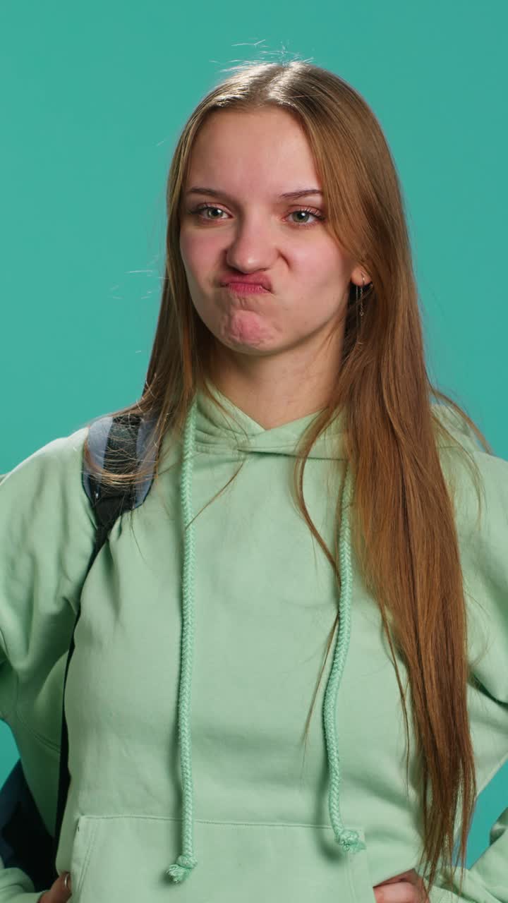 Vertical video Young actress goofing around, switching emotions and facial expressions