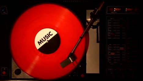 a record player turntable with it's stylus running along a vinyl record