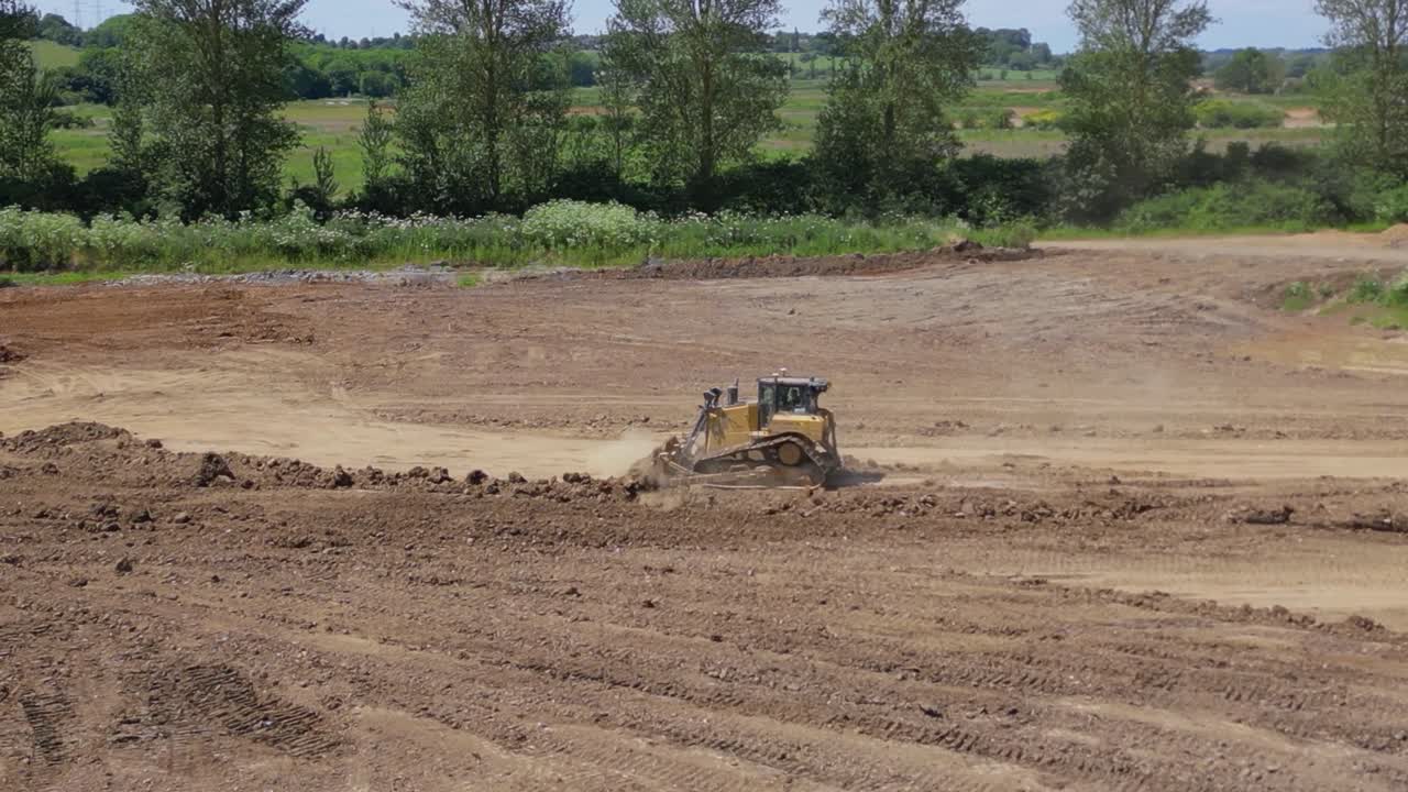 Landfill operations, dozer - Aerial Footage, dolly in