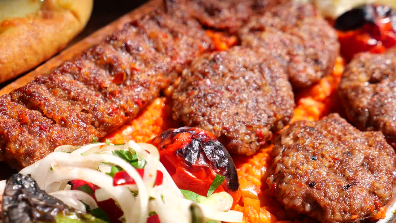Delicious Turkish Kofte (Meatballs) with Grilled Vegetables and Sauce
