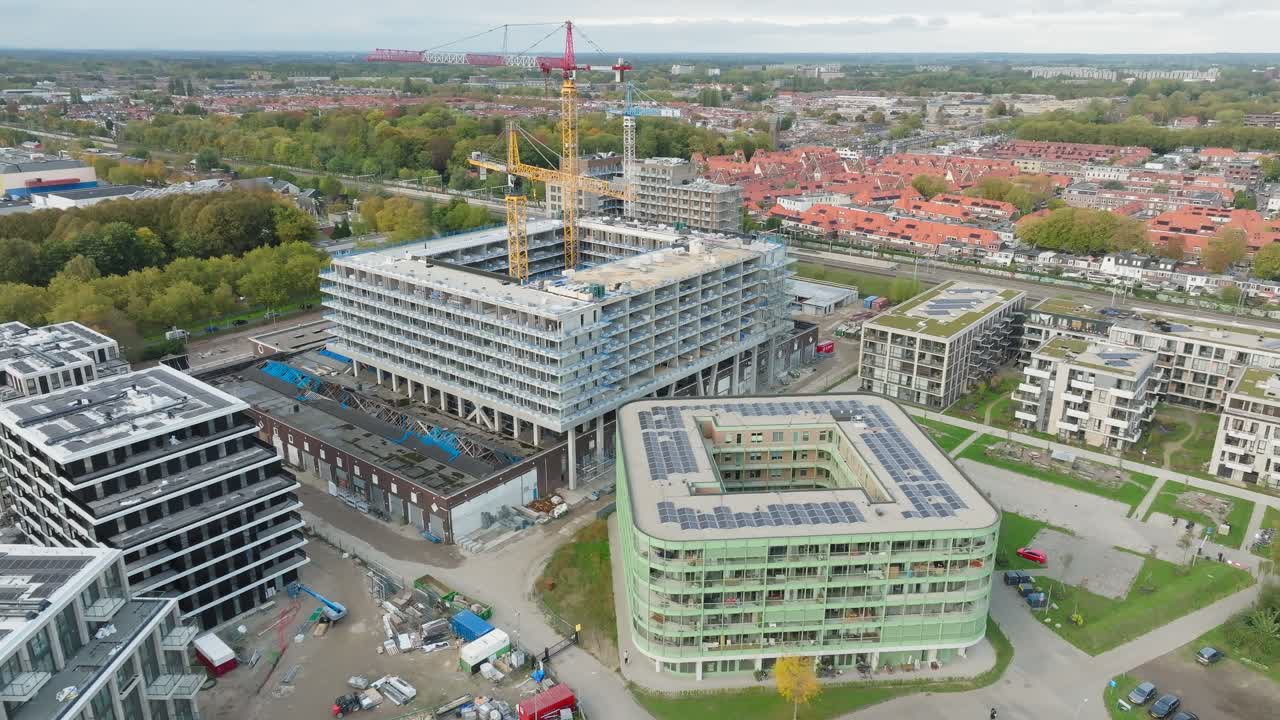 Construction site building new apartments in residential area, development and expanding city