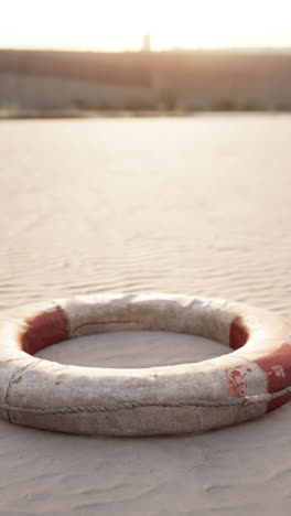 life preserver on a sandy beach