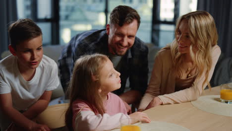 cute family having video call at home. parents kids enjoying online conversation