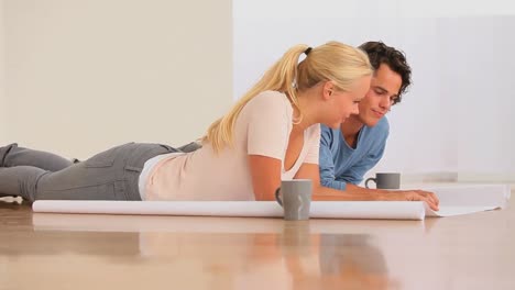 happy couple planning their new livingroom
