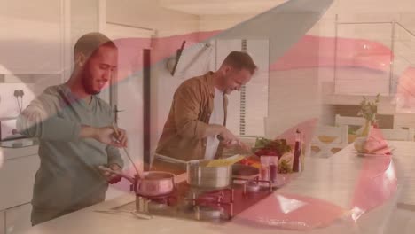 animación de manos cortando verduras sobre una pareja masculina diversa cocinando la cena en la cocina