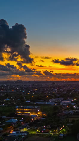 vertical view of holiday resort at sunset in bali, indonesia. timelapse