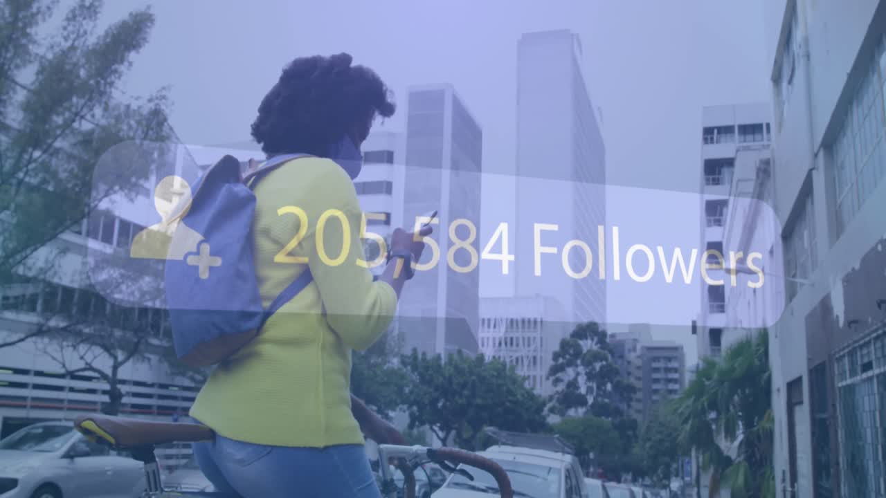 Animation of social media notification over african american woman in mask using phone in street