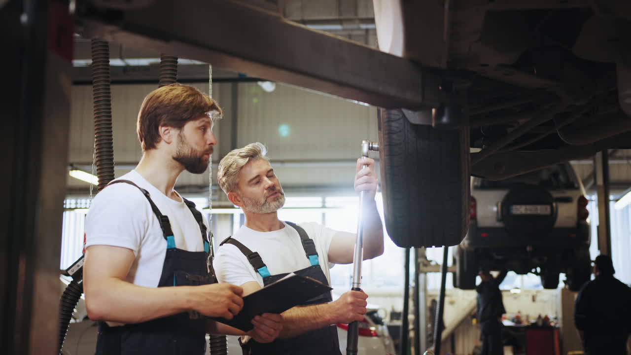 Car Repair Technicians Working on a Vehicle