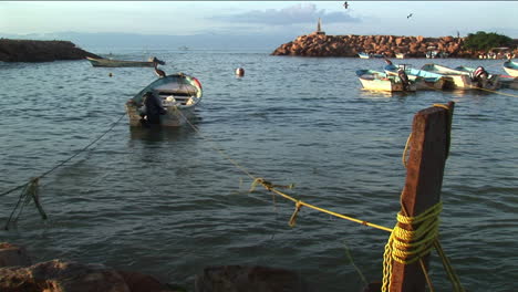 A-motor-boat-tethered-to-a-dock-rocks-in-the-waves