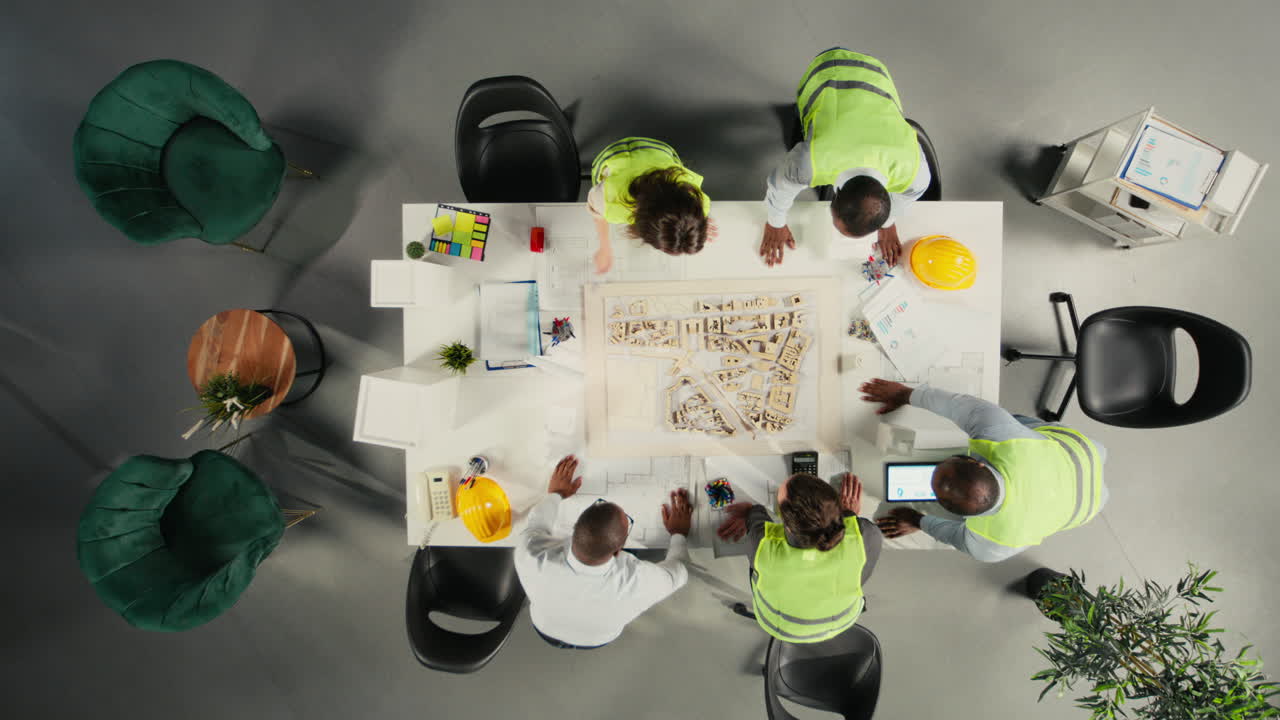 Vertical Video Top down view of doctors team in a collaborative meeting discussing therapy