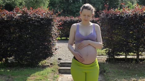 Pregnant-Caucasian-woman-walking-through-nature