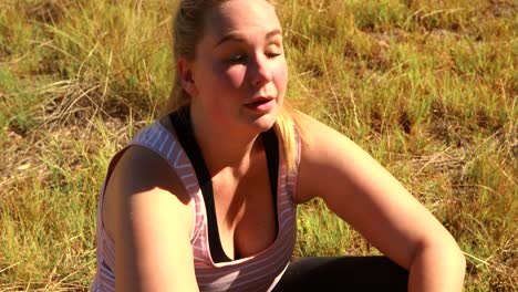 woman wiping sweat after workout