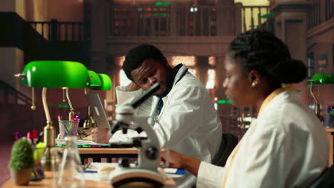 female college student focuses on medical science by using a microscope