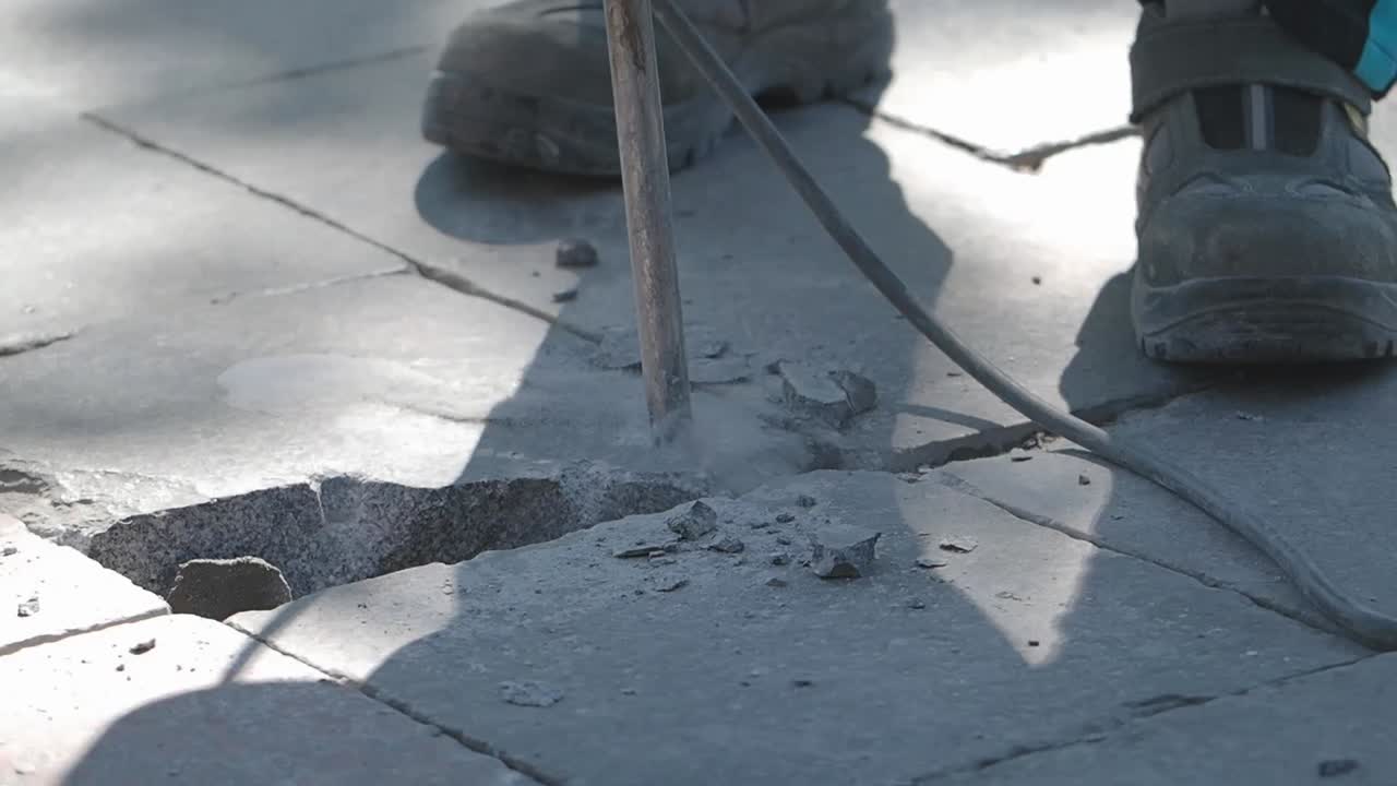 Jackhammer Breaking Paving Stones