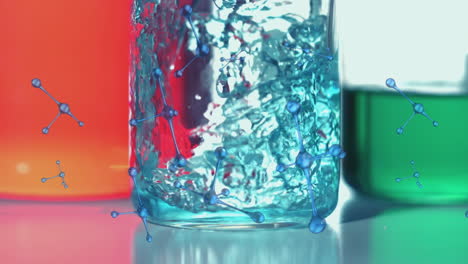 animation of molecules spinning over blue liquid pouring into laboratory beaker