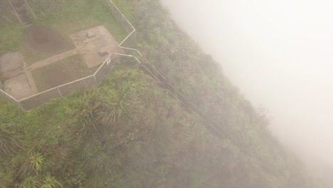 a misty mid-way platform on oahu's steep haiku stairs