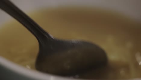 Eating-A-Bowl-Of-Creamy-Delicious-Chicken-Noodle-Soup---Close-Up-Shot