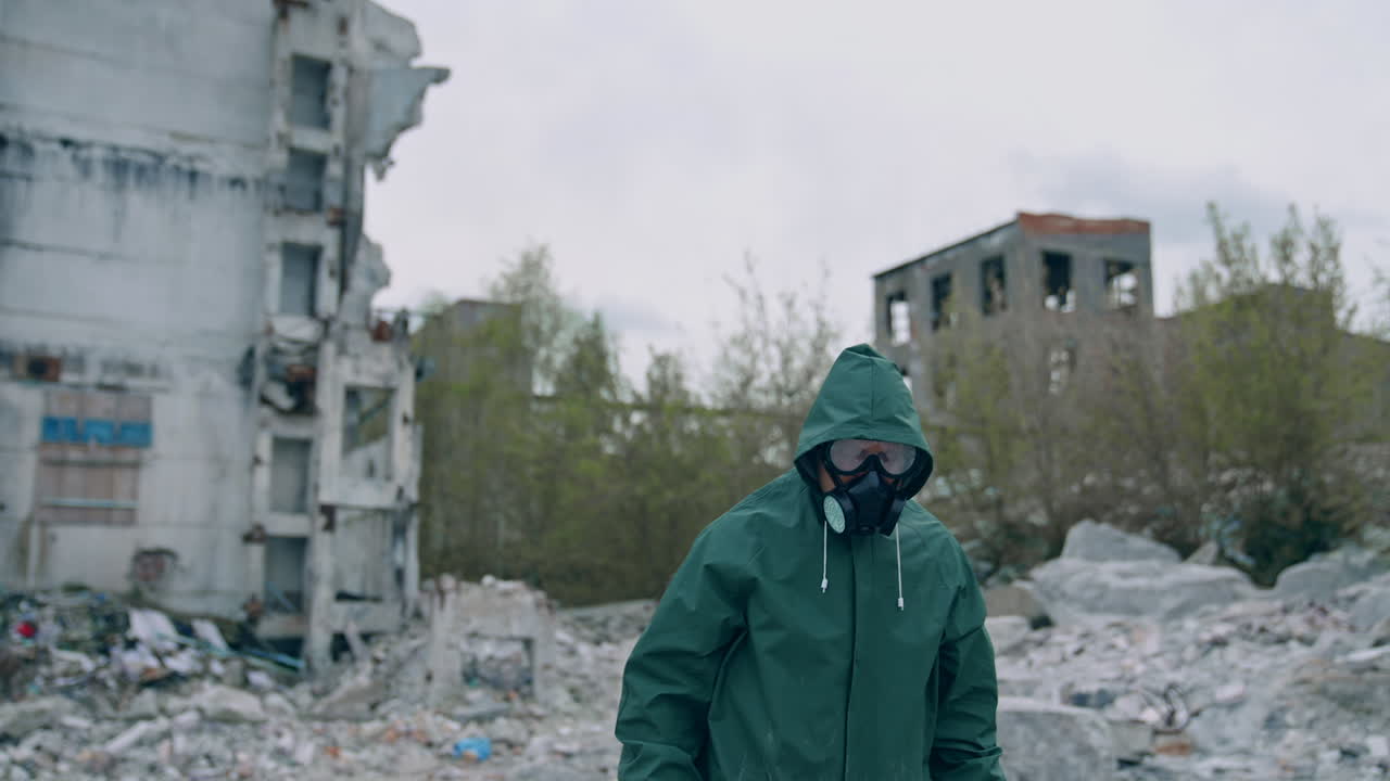 Man in protective suit and antigas mask with glasses. Safety virus infection concept.