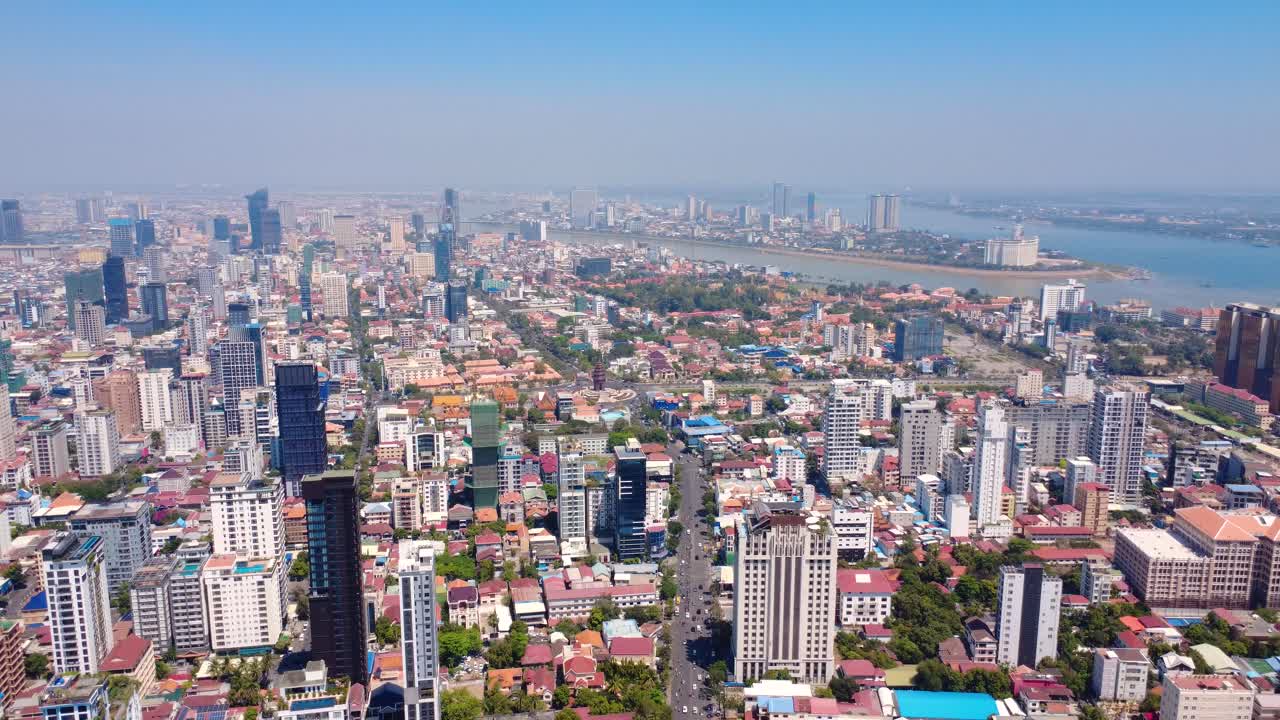 Vibrant aerial view of Phnom Penh city, Chamkar Mon, showcasing busy streets and tall buildings