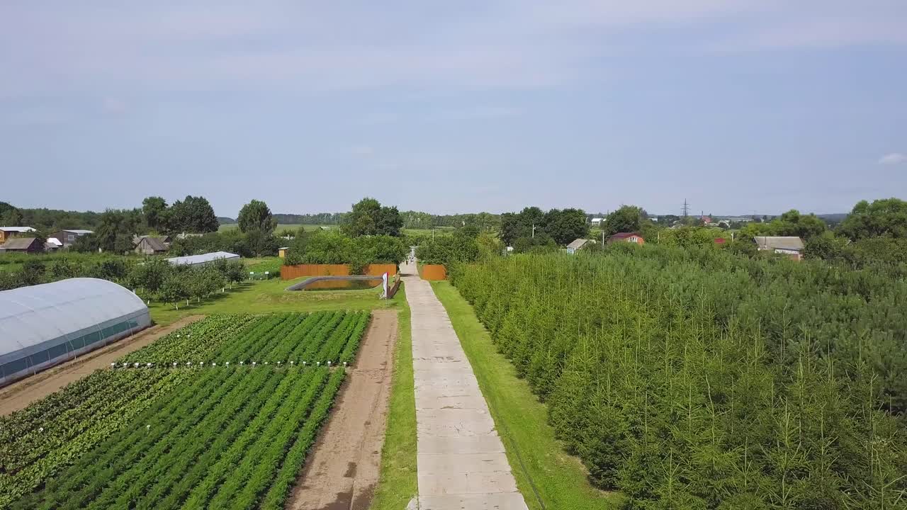 Rural Farmland with Greenhouse and Vegetable Fields