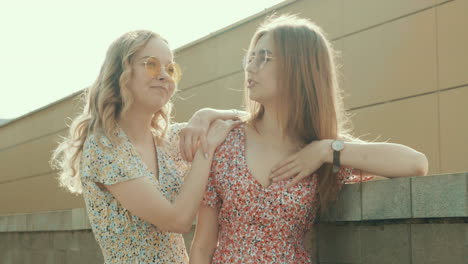 two women laughing outdoors