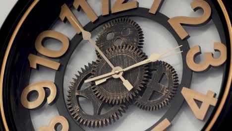 cropped vintage design wooden wall clock with open mechanism shows ten to two, second hand is running and moving clockwise