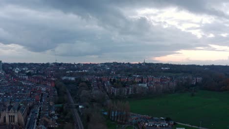 Aerial-rotating-drone-shot-over-residential-buildings-in-north-London-Hampstead-heath-evening