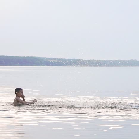 jumping in the water. man and boy are having fun and splashing in the water. summer holiday concept