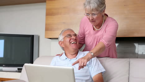 Senior-couple-using-laptop-together