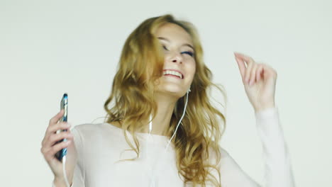 she hops and listening to music filmed at studio on a white background hd video