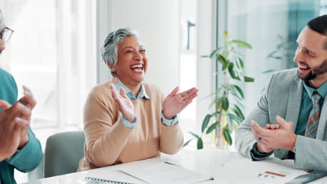 diverse business team celebrating success in modern office