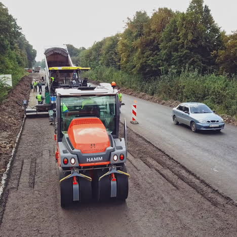 road construction works with roller compactor machine and asphalt finisher. construction of the road. aerial view