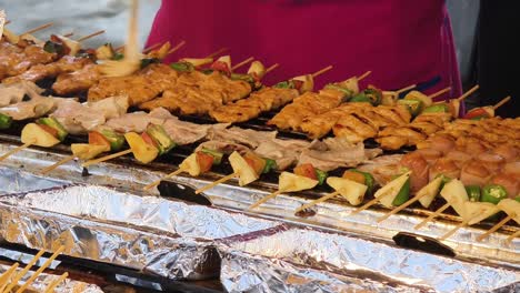 grilled skewers at a street food stall