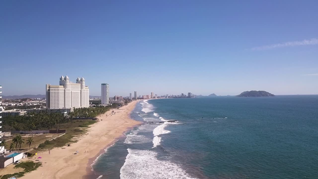 Mazatlán tropical sandy beach, Playa Buras, with Hotel Riu Emerald Bay on sunny day