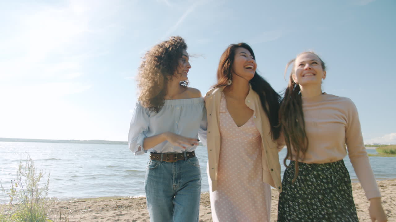 Three friends enjoying a summer day at the beach